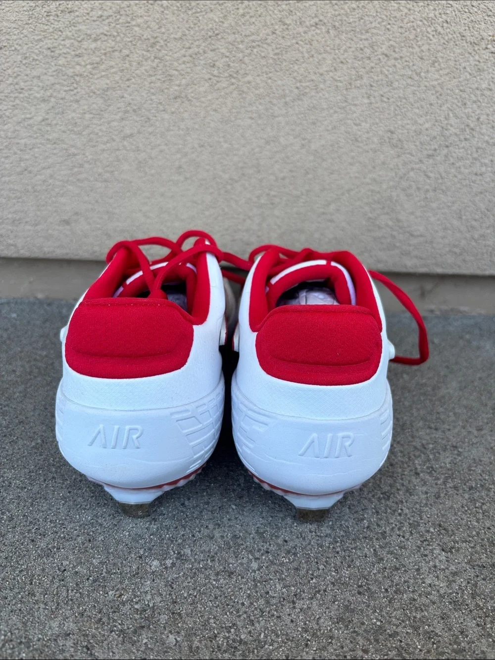 Nike White and Red Softball Cleats with Red Swoosh